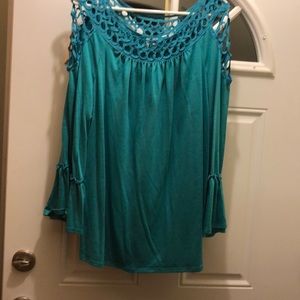 Tunic style top with cut outs around neck/shoulder